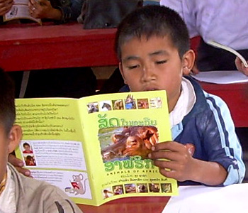 The book Animals of Africa being read