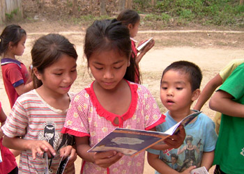 Children enjoy their books, at the end of a book party