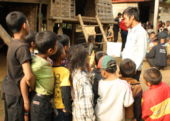 A village volunteer practices reading aloud