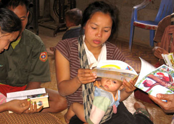 A home-based library in Laos. This woman is looking at 