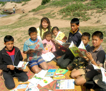 Setting up a home-based library in a Lao village.